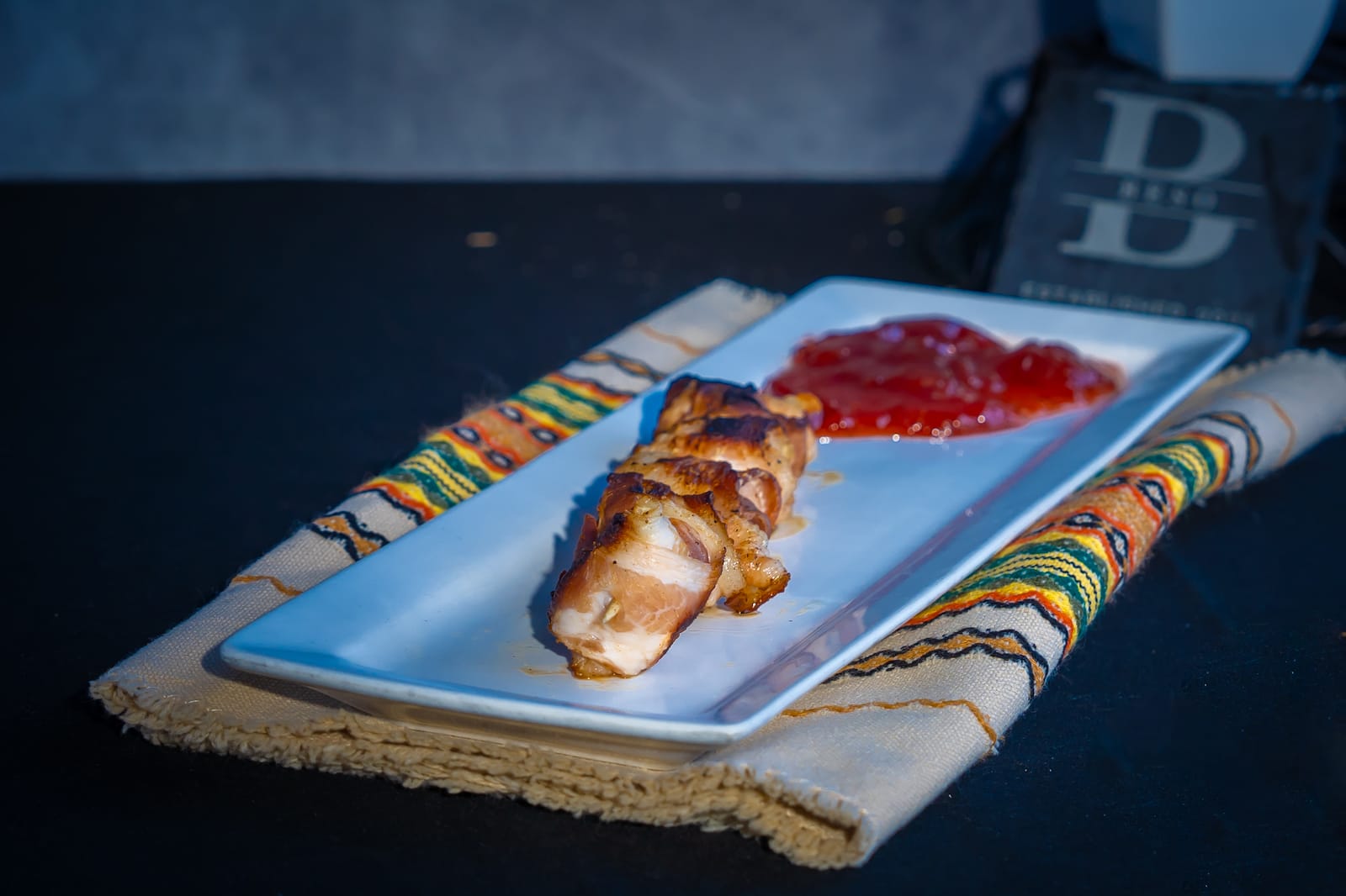 Bacon wrapped feta with strawberry jam at Beso Las Vegas