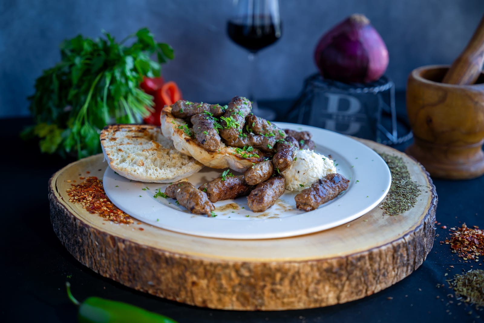 Cevapi grilled minced meat in bread with onions and kajmak at Beso Las Vegas